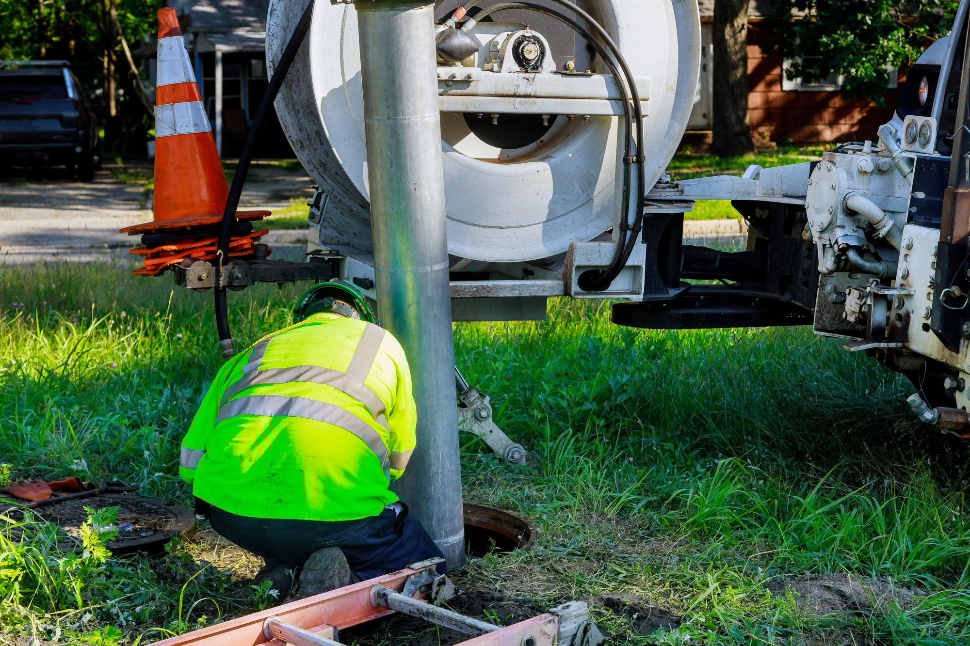 Sewage industrial cleaning truck clean blockage in a sewer line.